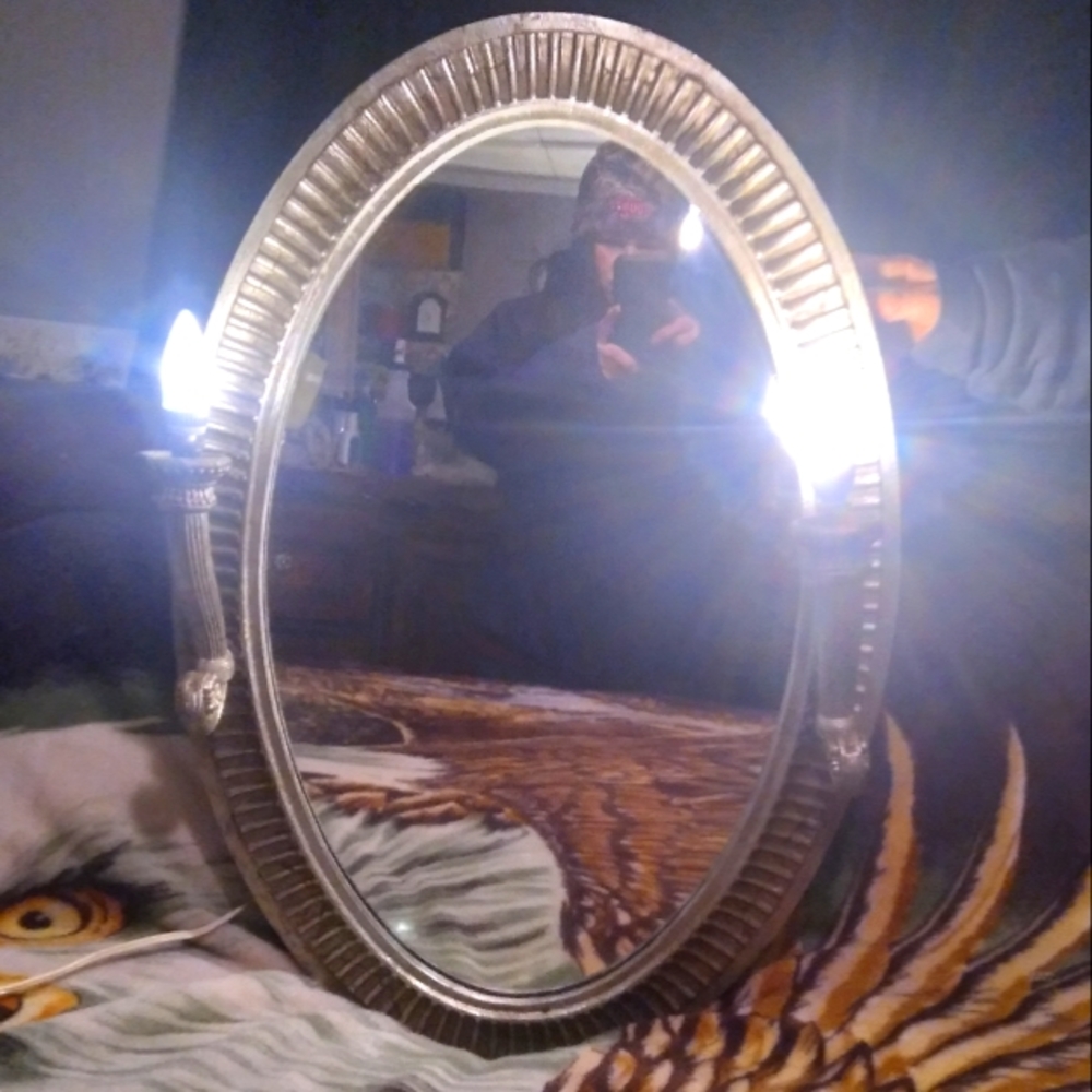 Hanging mirror with lights on the side